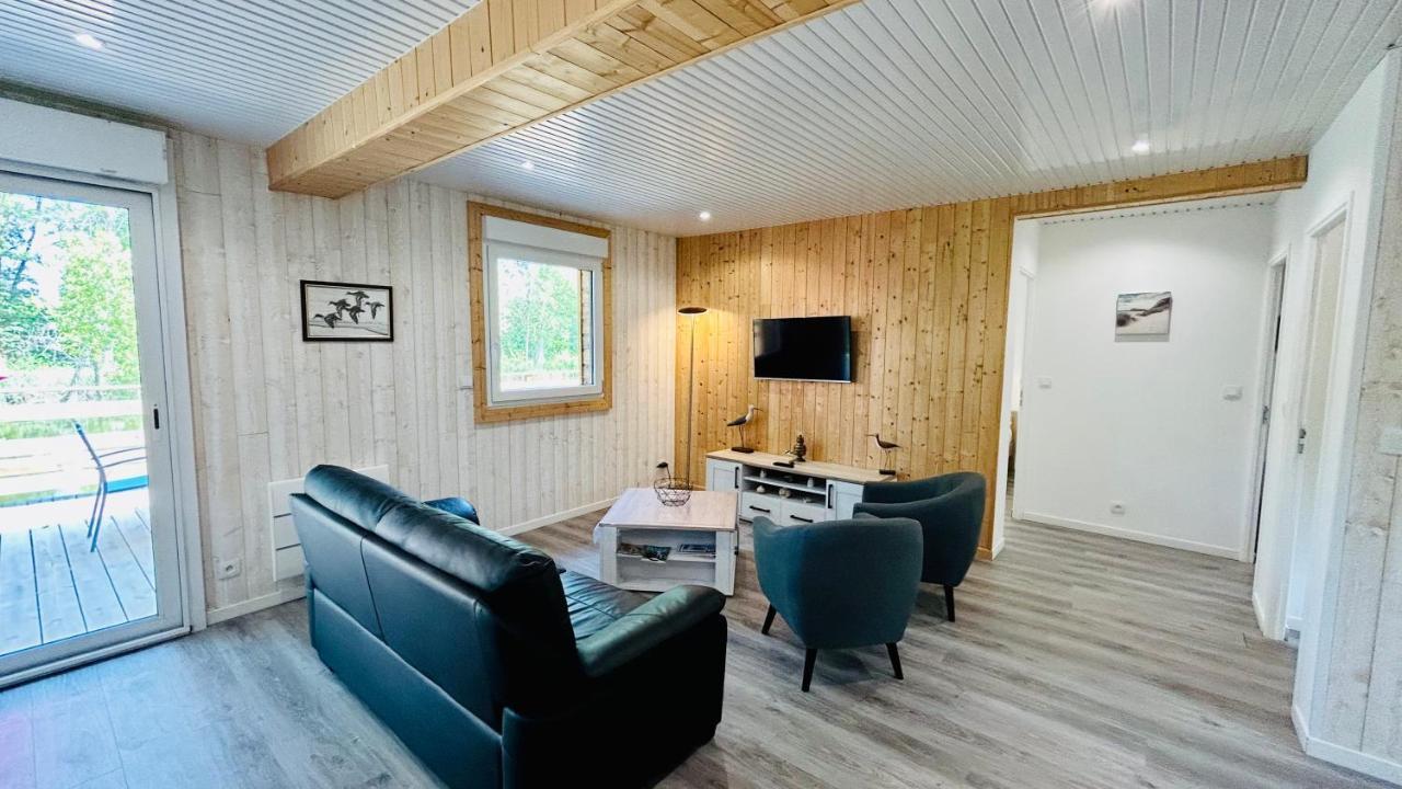 Chalet avec terrasse sur pilotis vue sur l'étang Rue  Esterno foto